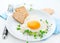 Healthy breakfast. Fried heart shaped egg