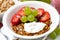 healthy breakfast with fruits, granola and milkshake, closeup