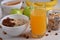 Healthy Breakfast. Granola, orange juice, nuts on a white table