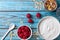 Healthy breakfast with greek yogurt, raspberries and muesli on blue wooden table top view