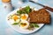 Healthy breakfast: Hard boiled eggs, fresh radish sprouts, arugula and dark whole wheat