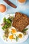 Healthy breakfast: Hard boiled eggs, fresh radish sprouts, arugula and dark whole wheat bread