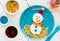 Healthy breakfast idea for kids - christmas snowman from cottage cheese and corn flakes