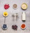Healthy breakfast ingredients with handwritten text lettering : honey, oatmeal , Chia seeds, Goji berries, fresh berries and bott