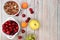 Healthy breakfast with ingredients, summer fruits and berries with granola, grapes, cherries and peaches on a bright table. The