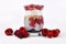 Healthy breakfast layered in glass with chia seed pudding, puffed quinoa grains and joghurt topped with red raspberry and cranberr