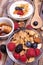 Healthy breakfast with low-fat yogurt, cereals, fresh berries, nuts and honey