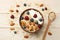 healthy breakfast. oatmeal, blueberries, raspberries and nuts on white wooden table. Top view