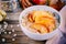 Healthy breakfast: oatmeal bowl with caramelized apples, cinnamon and honey