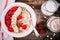 Healthy breakfast: oatmeal with fresh raspberries, banana, flax seeds and pumpkin seeds