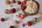 Healthy Breakfast of oatmeal, walnuts and fresh delicious organic strawberries close-up on a light marble background.