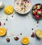 Healthy breakfast with porridge, strawberries, fresh orange juice, mango and nuts place text,frame on wooden rustic background