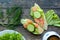 Healthy breakfast, sandwiches coffee salad eggs on dark wooden background. Plate food green vegetarian