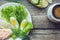 Healthy breakfast, sandwiches coffee salad eggs on dark wooden background. Plate food green vegetarian