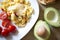 Healthy breakfast with scramble eggs, vegetables and avocado