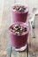 Healthy breakfast of smoothie, dessert, yogurt or milkshake with frozen berry and oats decorated grated chocolate