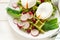 Healthy breakfast: spinach waffles with radish slices and poached eggs
