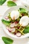 Healthy breakfast: spinach waffles with radish slices and poached eggs