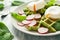 Healthy breakfast: spinach waffles with radish slices and poached eggs