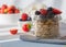 Healthy breakfast super food cereal concept with fresh fruit, granola, yoghurt, nuts and pollen grain, with foods high in protein,