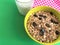 Healthy Breakfast whole grain oat cereal with seeds and glass of milk