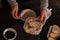 Healthy breakfast, woman adding musli to a plate for adding milk and have a meal