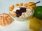 Healthy breakfast with yoghurt, oat flakes and mandarine