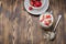 Healthy breakfast. Yogurt, fresh strawberry,  spoon with the scattered granule on a wooden table. Copyspace and top view