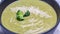 Healthy broccoli green cream soup in bowl. Long banner format, top view. Diet detox food concept