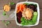 Healthy buddha bowl, above view over rustic wood