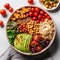 Healthy Buddha bowl with quinoa, chickpeas, avocado, tomatoes, herbs and hummus. Vegan food concept.