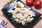 Healthy caesar salad on the black plate
