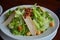 Healthy Caesar salad made of fresh vegetables , chicken and bacon