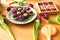 Healthy candies on a blue plate and purple tulips