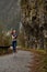 healthy caucasian female with red hair doing exercises jogging in nature alone, side view