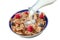 Healthy cereal breakfast. with Berries - fresh strwberries and blueberries, with milk pourring on white