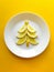Healthy and cheerful food for children, Christmas and New Year, a lemon tree, yellow background