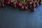 Healthy cherry fruits on a black slates, isolated