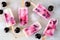 Healthy cherry yogurt ice pops, top down view scattered over white marble