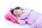 Healthy children concept. Asian girl sleeping peacefully. On white background.