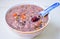 Healthy Chinese Grain Porridge in a Bowl with Jujube & Goji Berry on Top