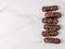 Healthy chocolate eclairs on marble background