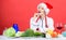Healthy christmas holiday recipes. Easy ideas for christmas party. Woman chef santa hat cooking at kitchen. Best