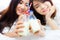 Healthy concept. Attractive beautiful women is celebrating anniversary of their friendship by drinking fresh milk instead alcohol