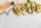 Healthy corn tortillas with grilled chicken, avocado, lime, beer