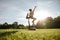 Healthy couple doing acro yoga on grass