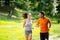 Healthy couple jogging in nature