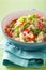 Healthy couscous salad with tomato cucumber onion chives