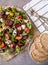 Healthy , delicious beetroot salad and goat cheese on variety of fresh mixed salad, garnished with pumpkin seeds and balsamic vine