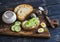 Healthy delicious breakfast or snack - open sandwich with goat\'s cheese and cucumber and boiled quail eggs.